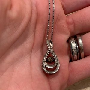 “Diamonds in Rhythm” pendant. 19” Chain.